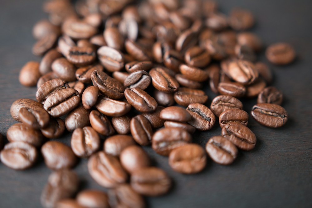 Hands cupping freshly roasted coffee beans